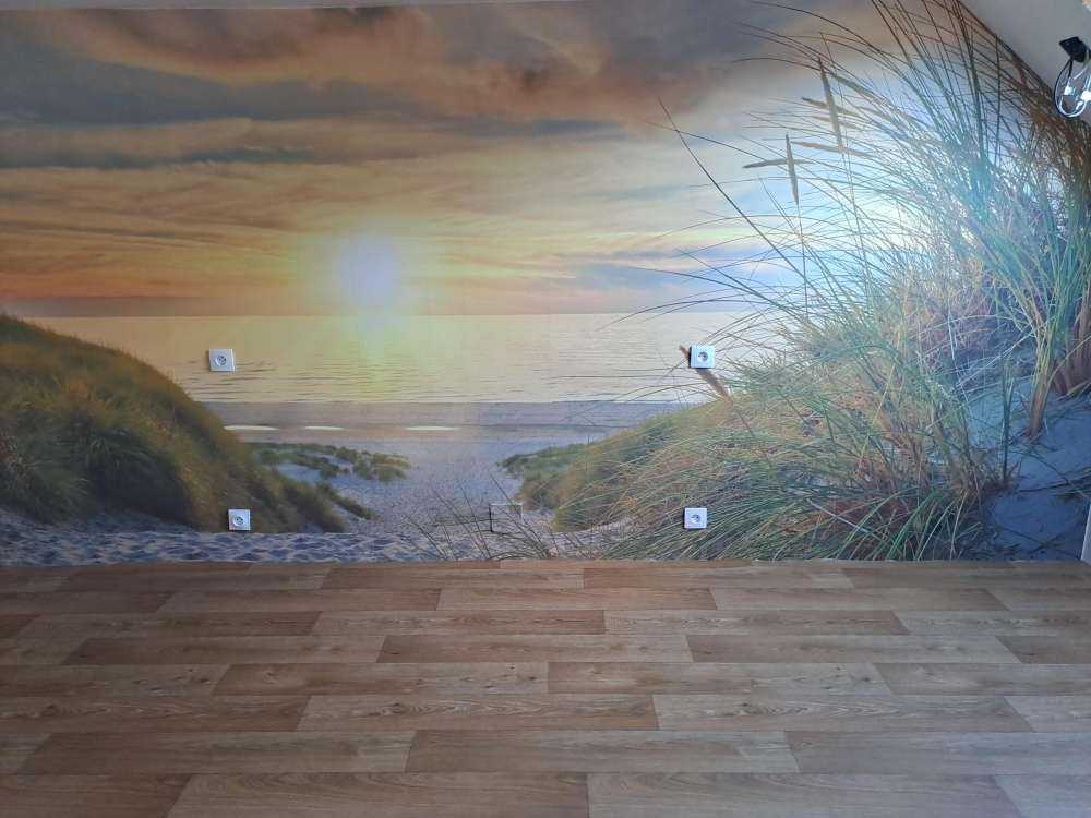 Solnedgång vid sanddynstranden