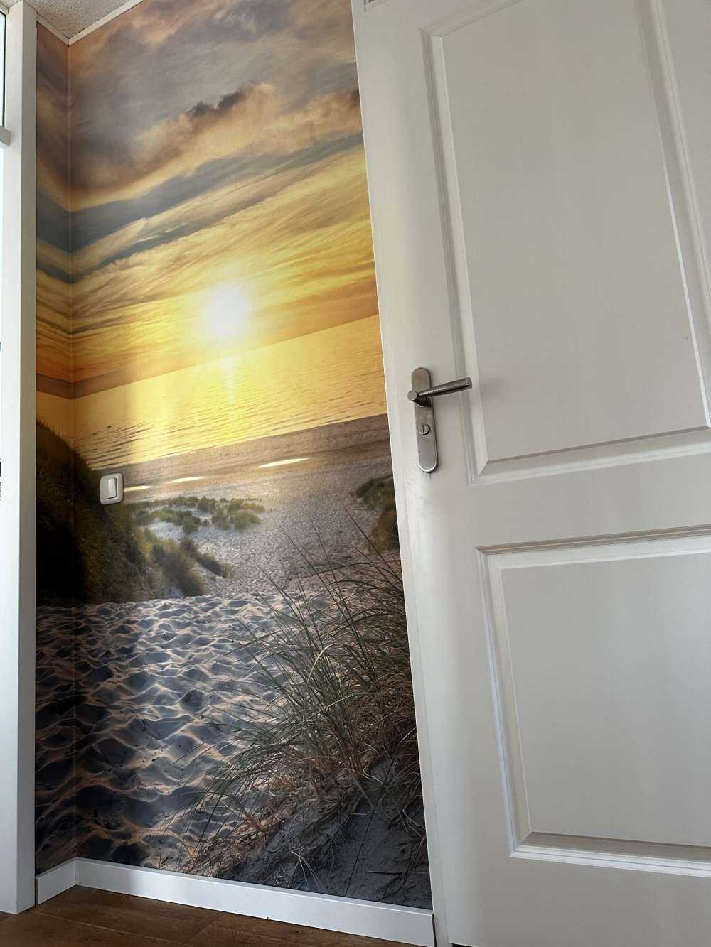 Solnedgång vid sanddynstranden