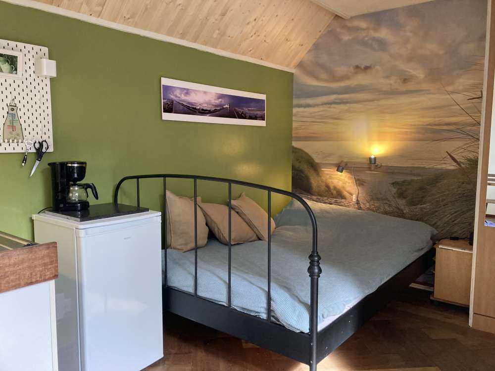 Solnedgång vid sanddynstranden