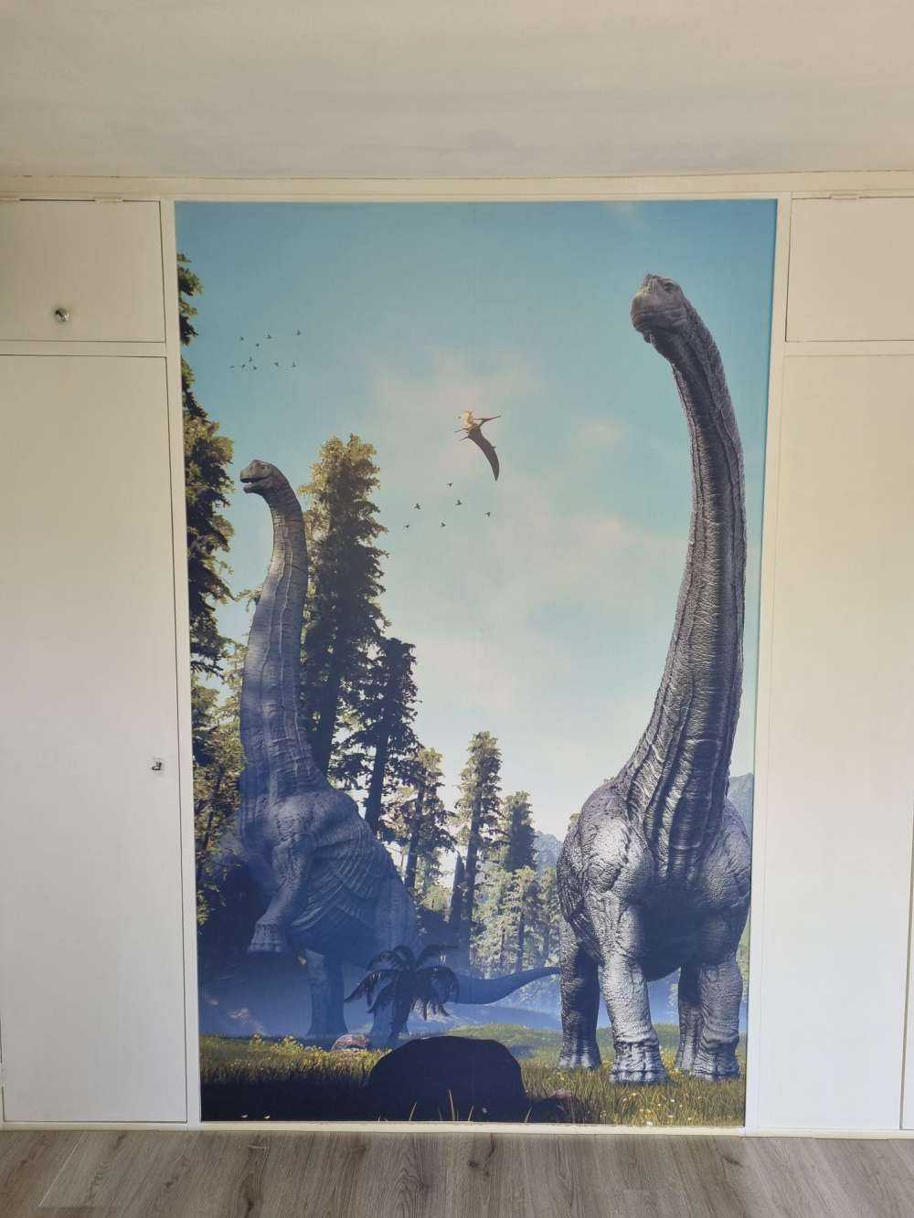 Alamosaurusgrupp som går genom en dal