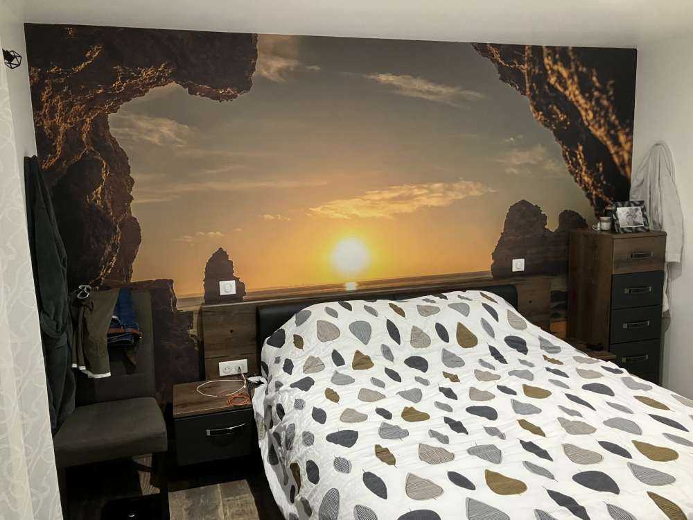 Soloppgang fra en hule