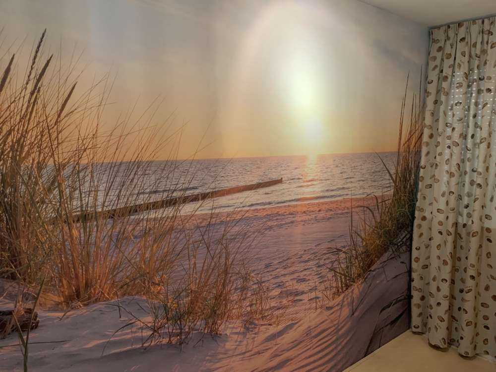 Klitstrand med solnedgang