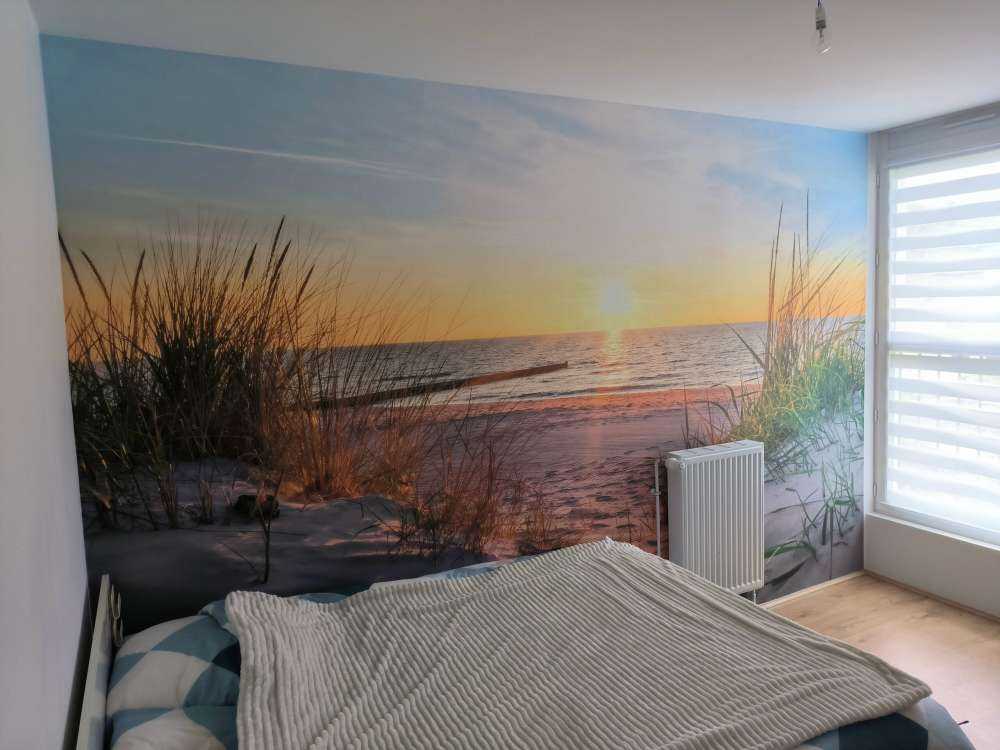 Klitstrand med solnedgang