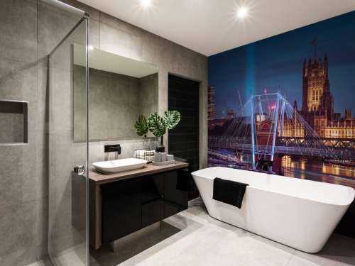 Night view of the London Eye, Golden Jubilee bridge and Westminster, London, UK