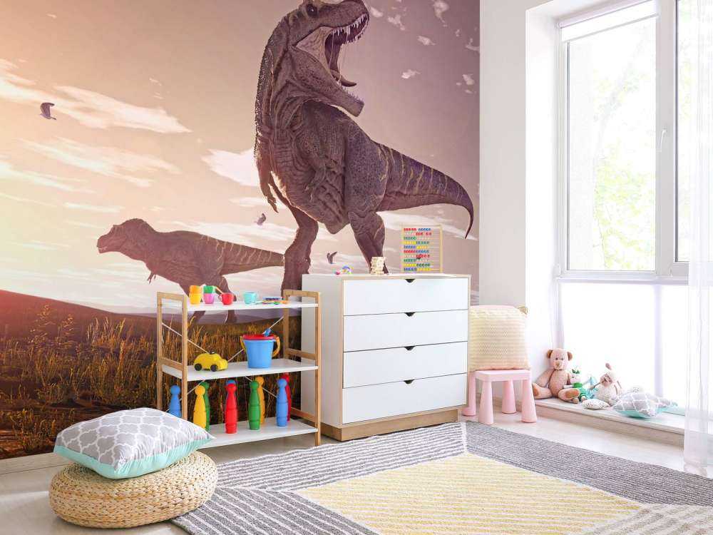 Två Tyrannosaurier i ett fält