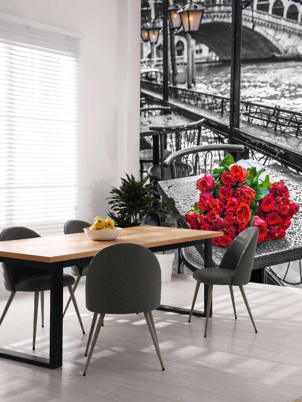 Bunch of red roses on street cafe table, Rialto Bridge, Venice, Italy