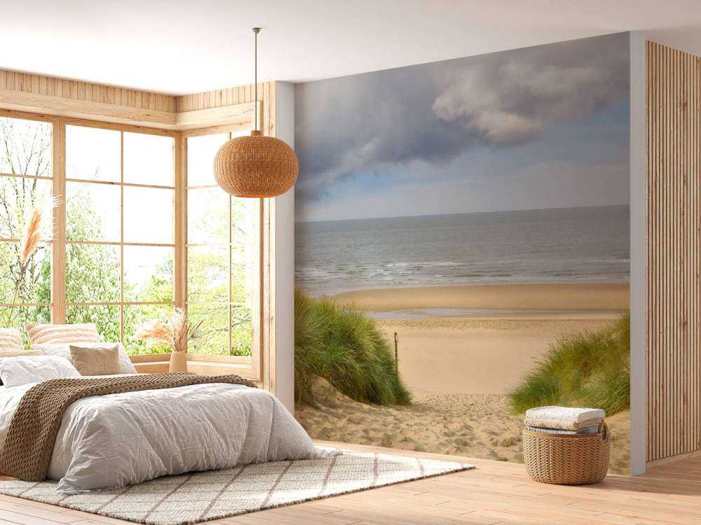 Solopgang på stranden ved kysten