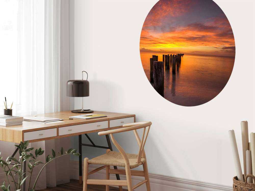 Bølgebrydere ved solopgang