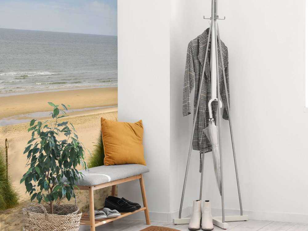 Solopgang på stranden ved kysten