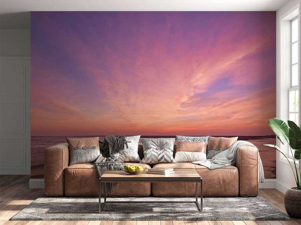 Strand med rosa solnedgang