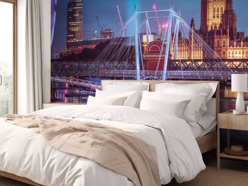 Night view of the London Eye, Golden Jubilee bridge and Westminster, London, UK