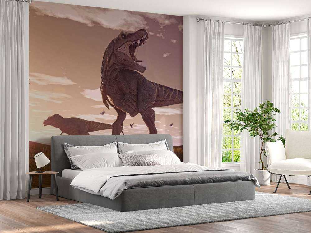 Två Tyrannosaurier i ett fält