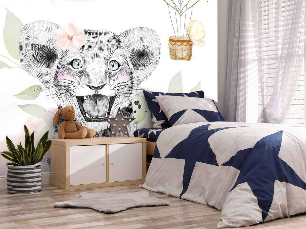 Gledelig løveunge og luftballong