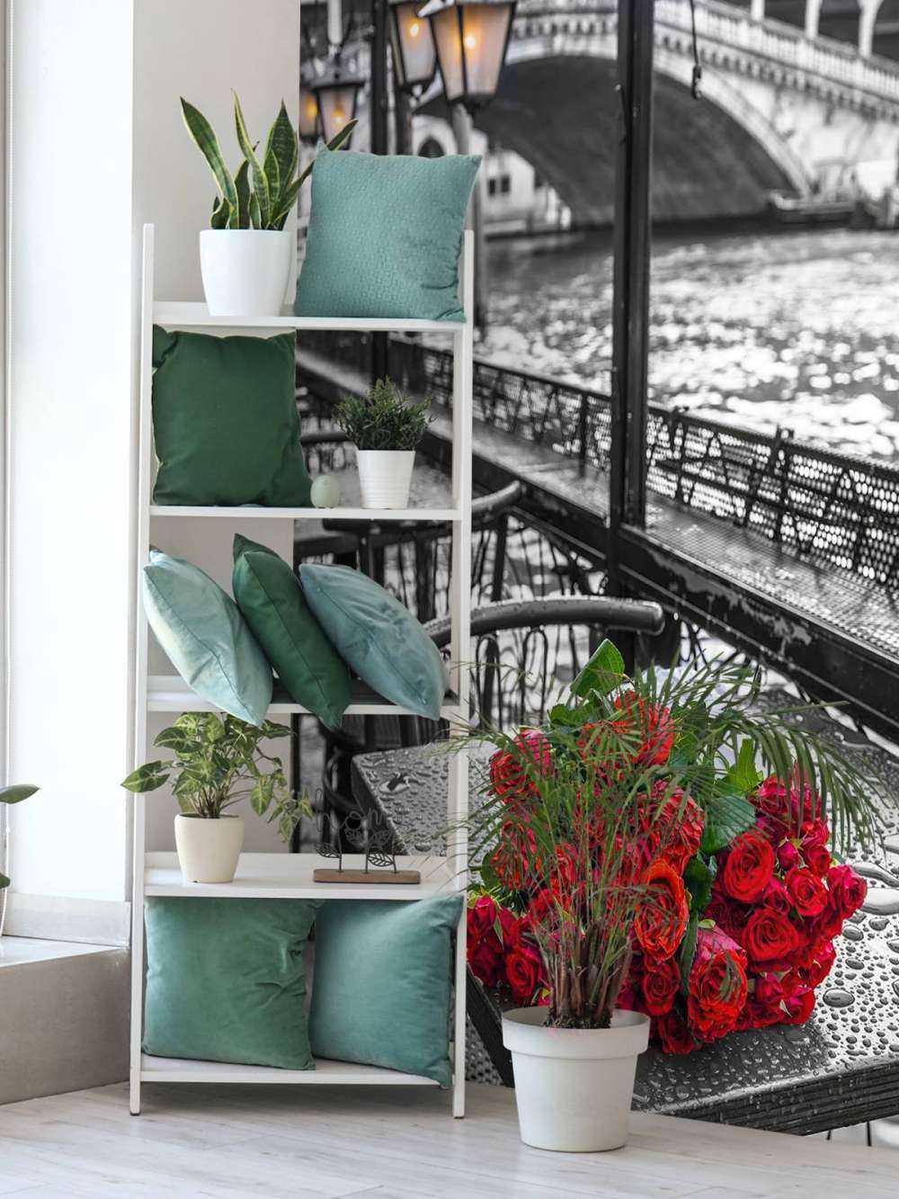 Bunch of red roses on street cafe table, Rialto Bridge, Venice, Italy