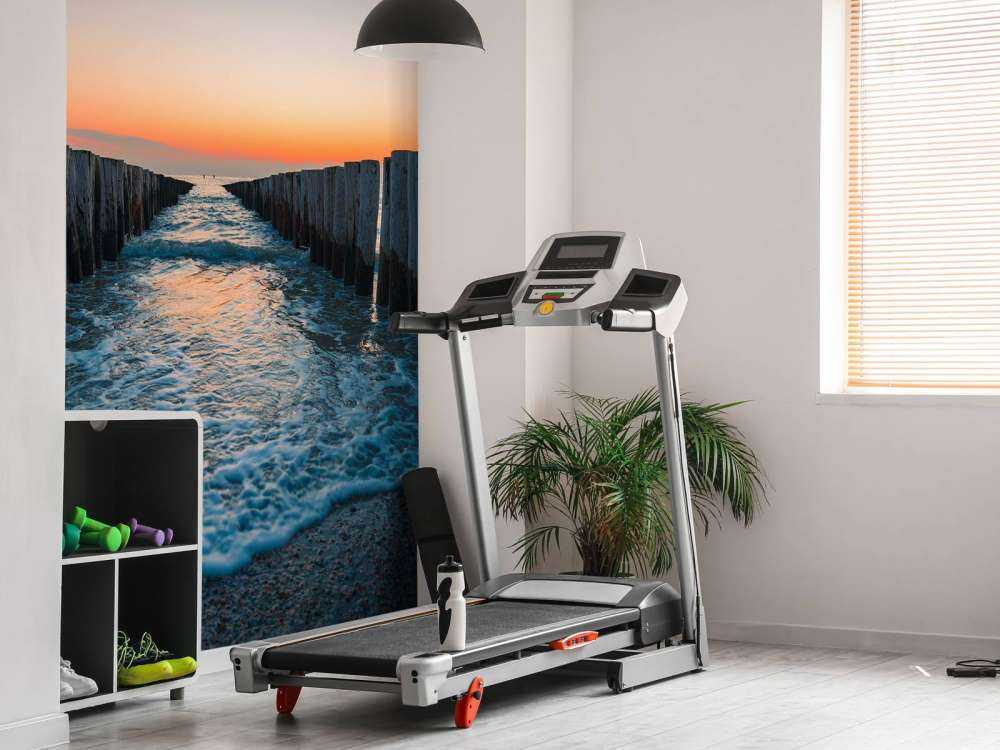 Bølgebrytere ved solnedgang