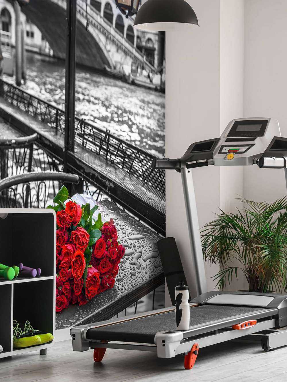 Bunch of red roses on street cafe table, Rialto Bridge, Venice, Italy