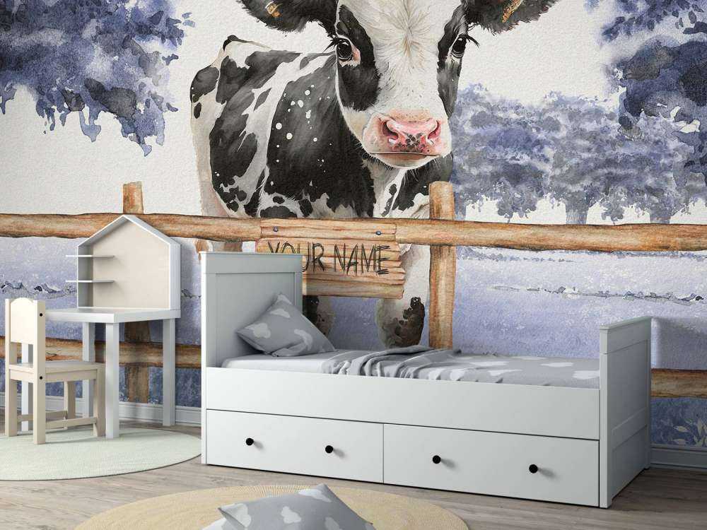 Ung ko på en blå eng