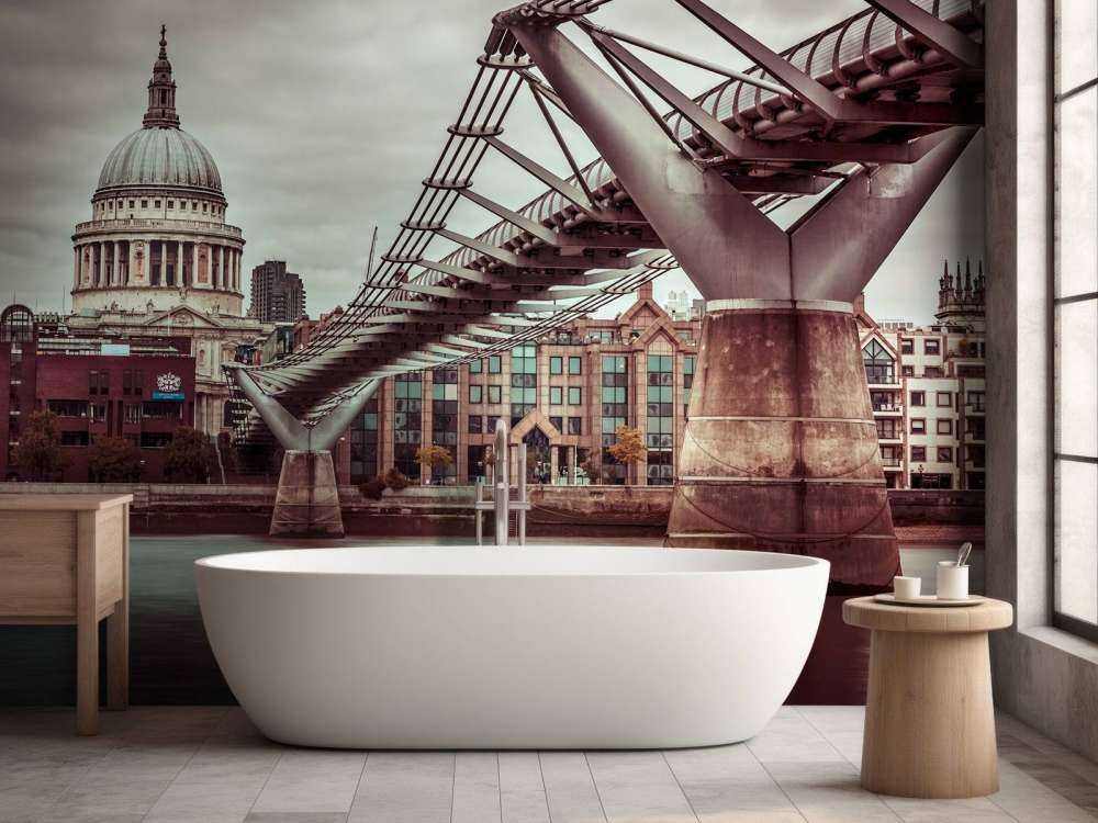 View of St Paul's Cathedral and Millennium Bridge from river thames, London, UK