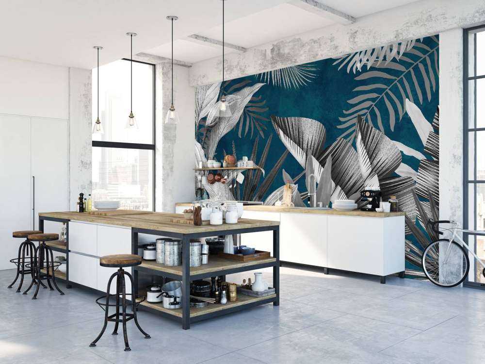 Tropiska blad på en blå bakgrund