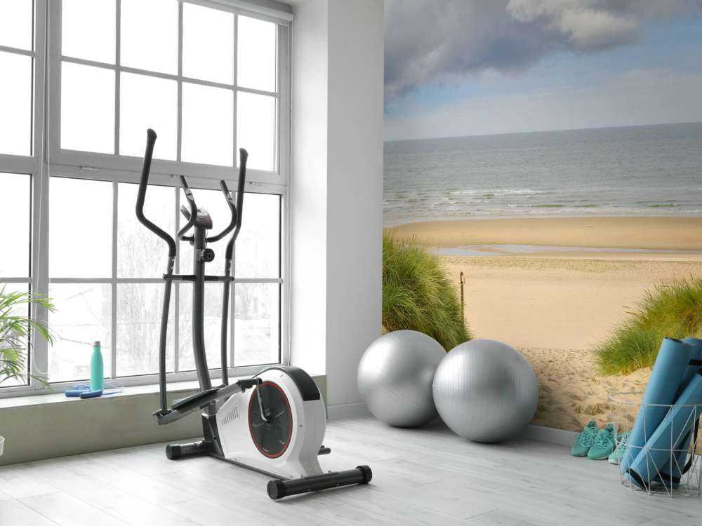 Solopgang på stranden ved kysten