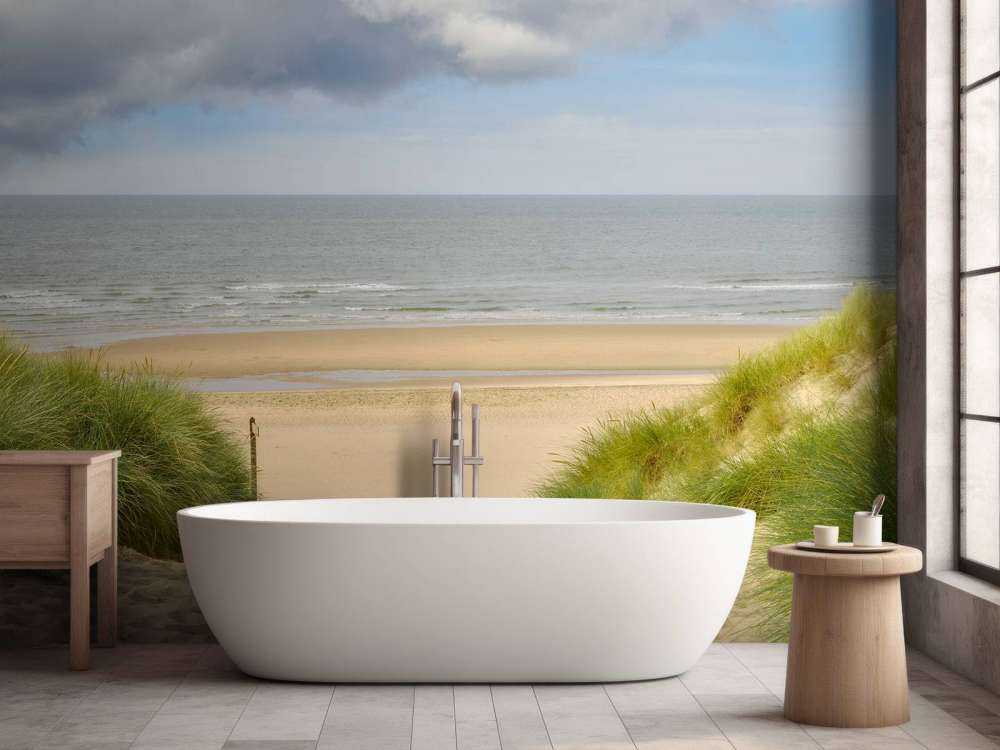 Solopgang på stranden ved kysten