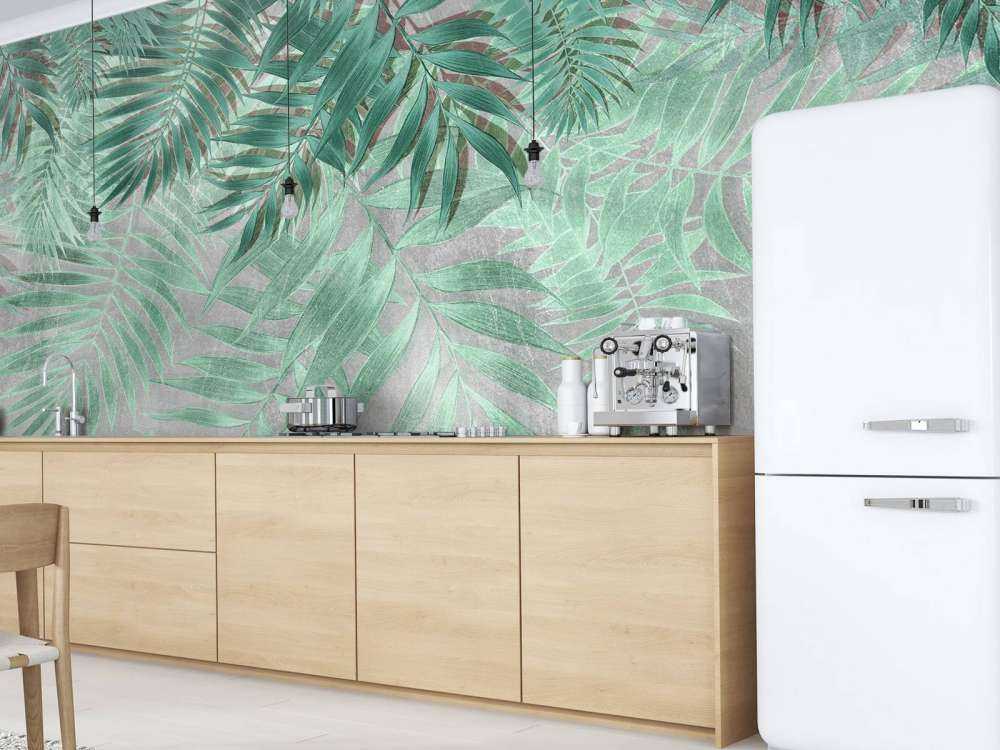 Grønne palmeblade med grå betonvæg