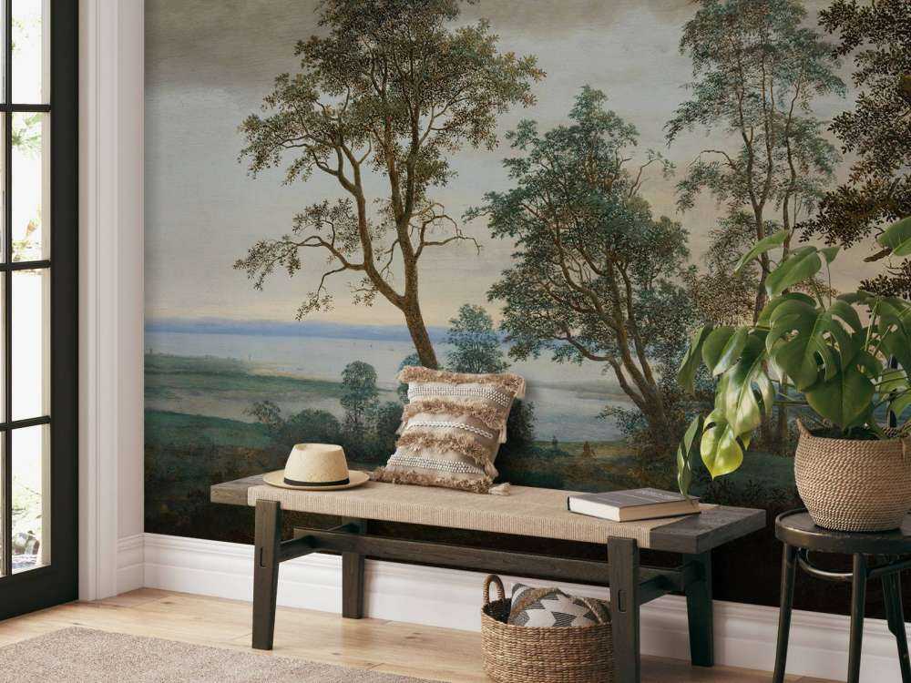 Flodlandskab set gennem træer