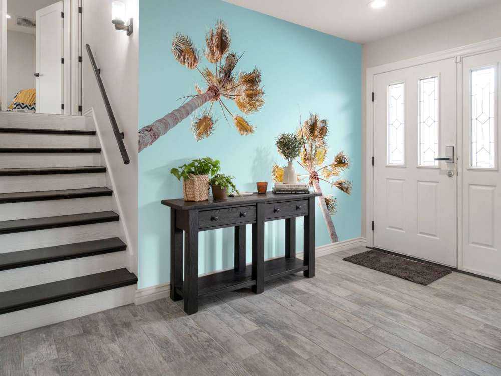 Palmetræer med blå himmel