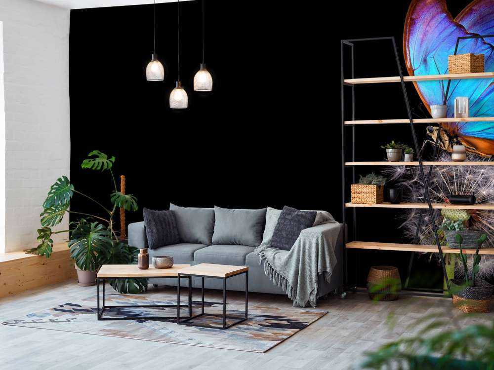 Blå sommerfugl på en løvetann