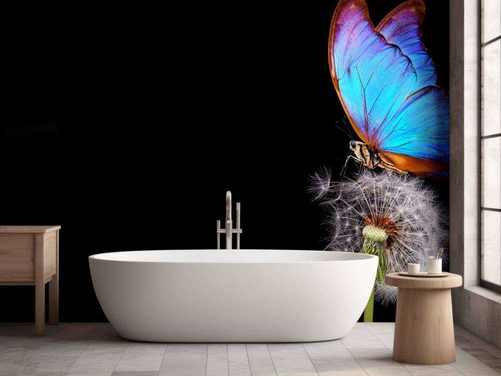 Blå sommerfugl på en løvetann