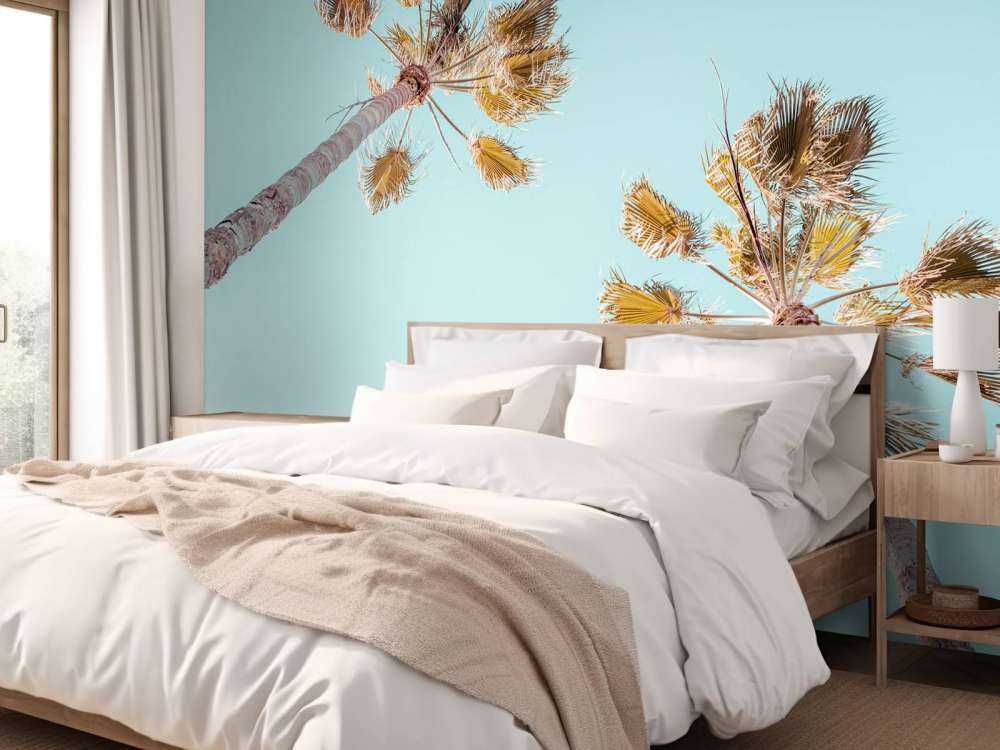 Palmetræer med blå himmel