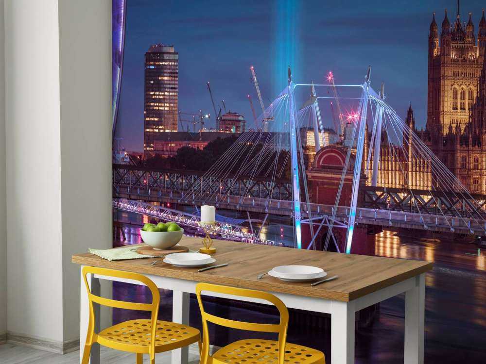 Night view of the London Eye, Golden Jubilee bridge and Westminster, London, UK