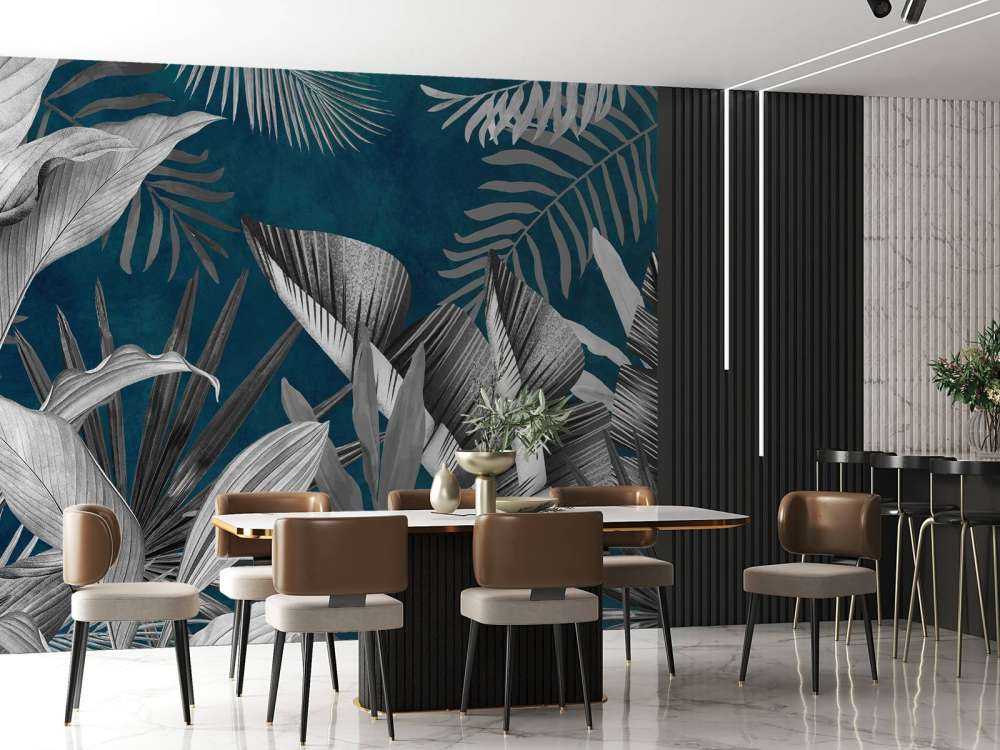 Tropiska blad på en blå bakgrund