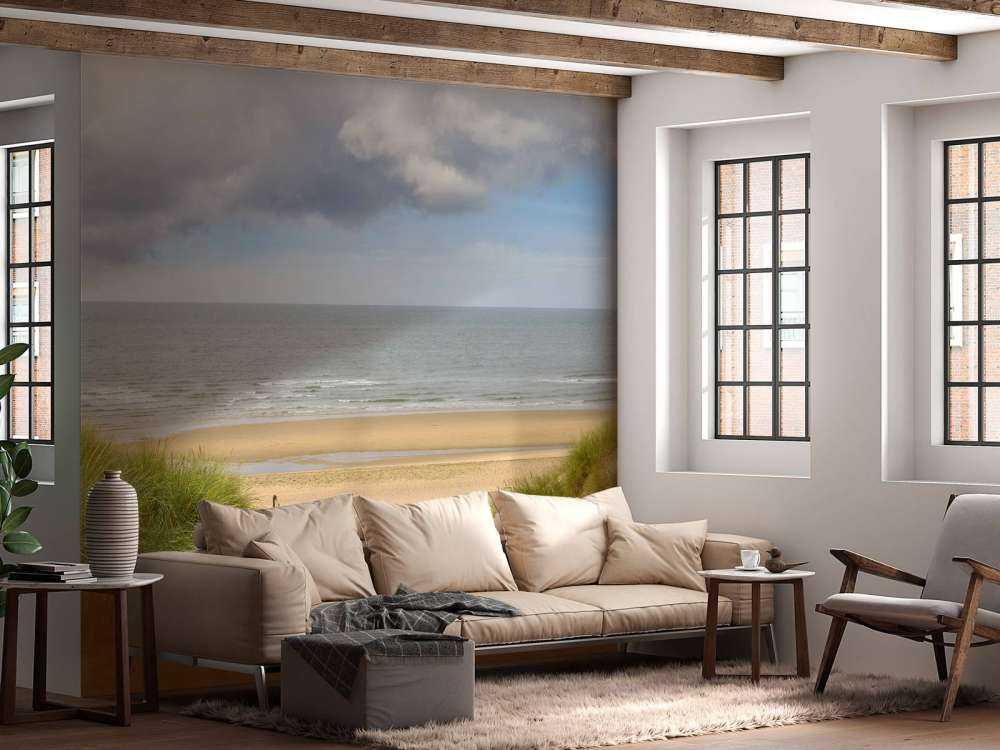 Solopgang på stranden ved kysten