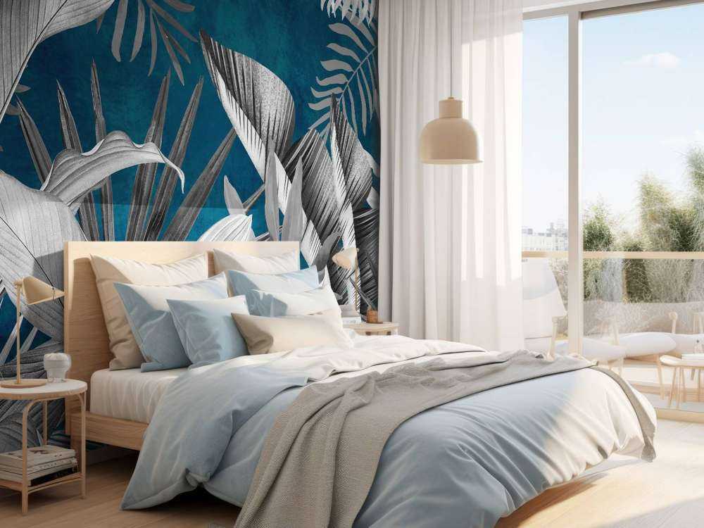 Tropiska blad på en blå bakgrund