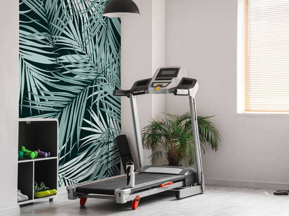 Tropiske blader på en svart bakgrunn