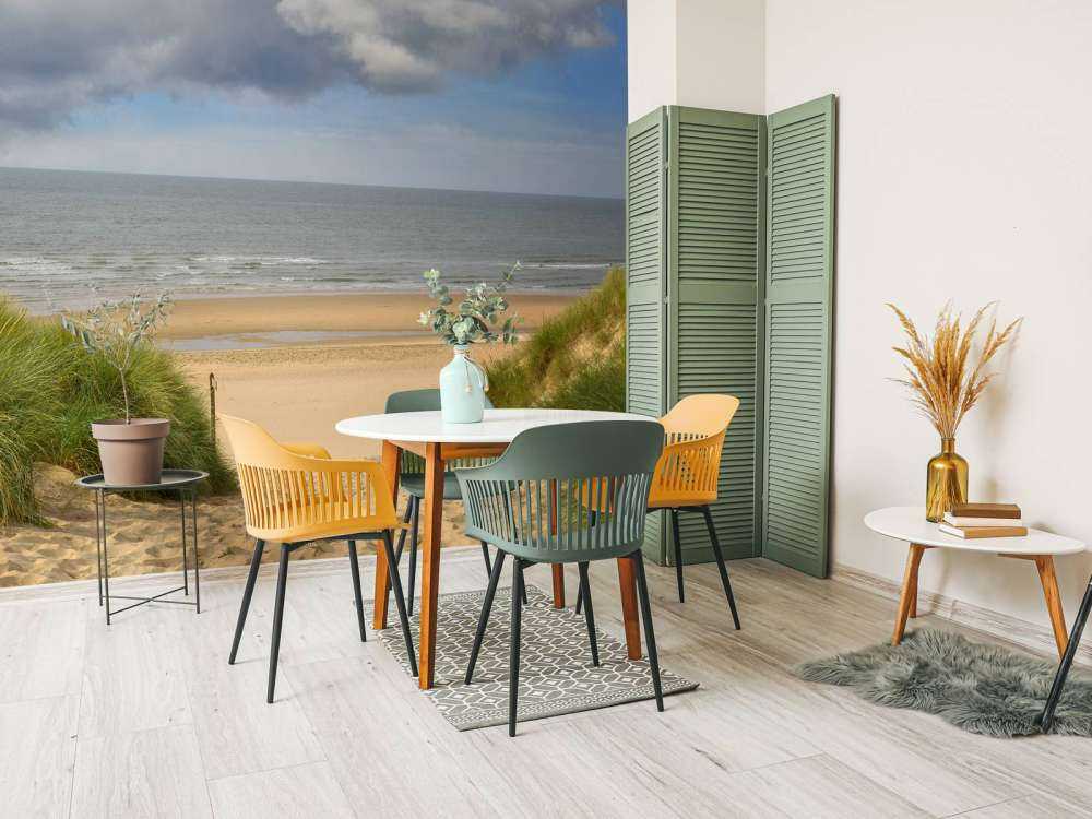 Solopgang på stranden ved kysten