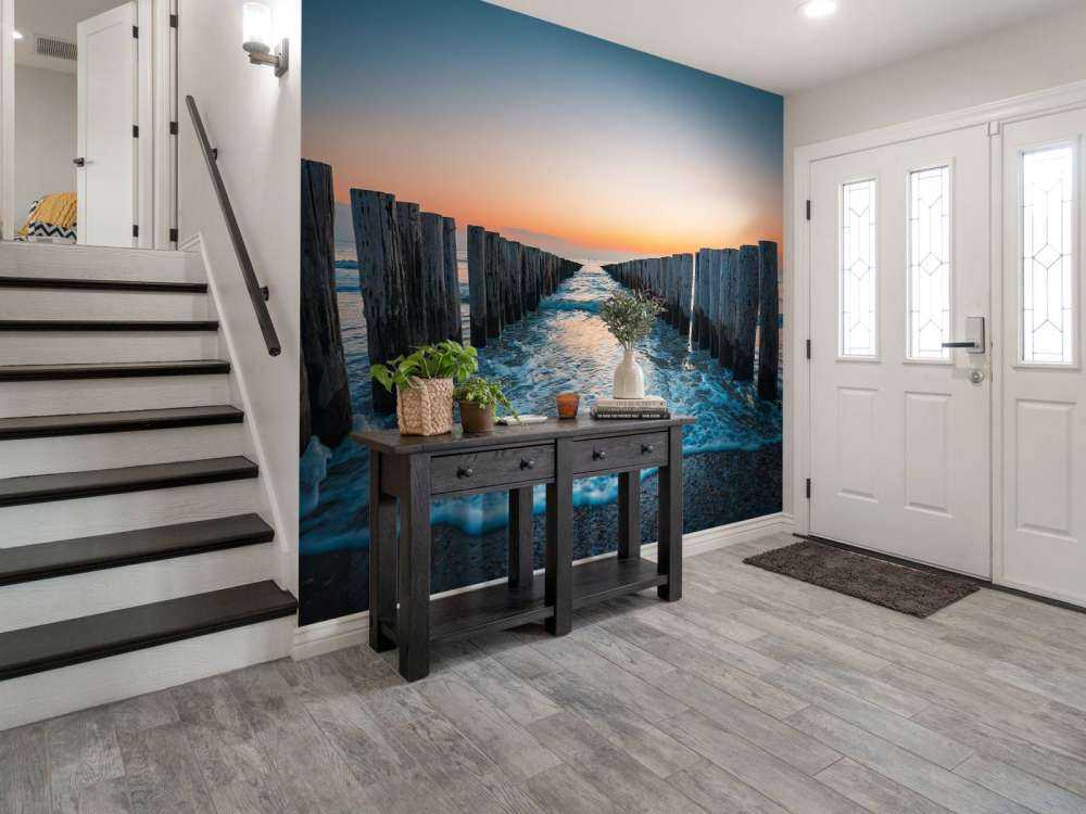 Bølgebrydere ved solnedgang