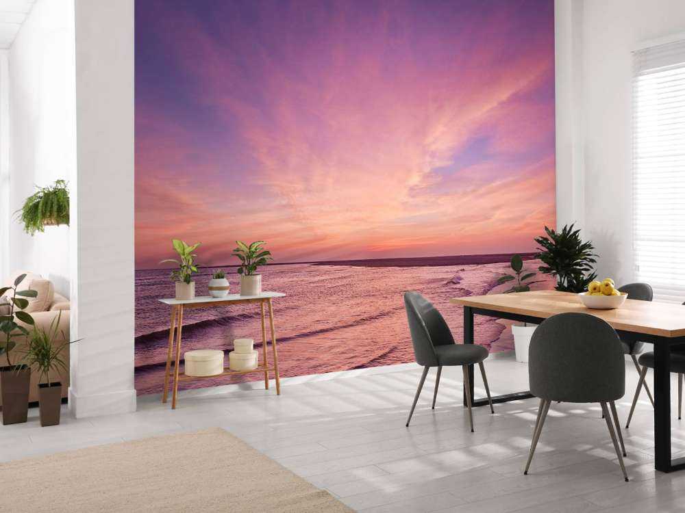 Strand med rosa solnedgang