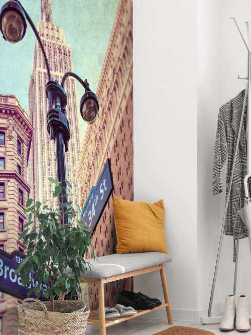 Street lamp and street signs with Empire State building in background - New York