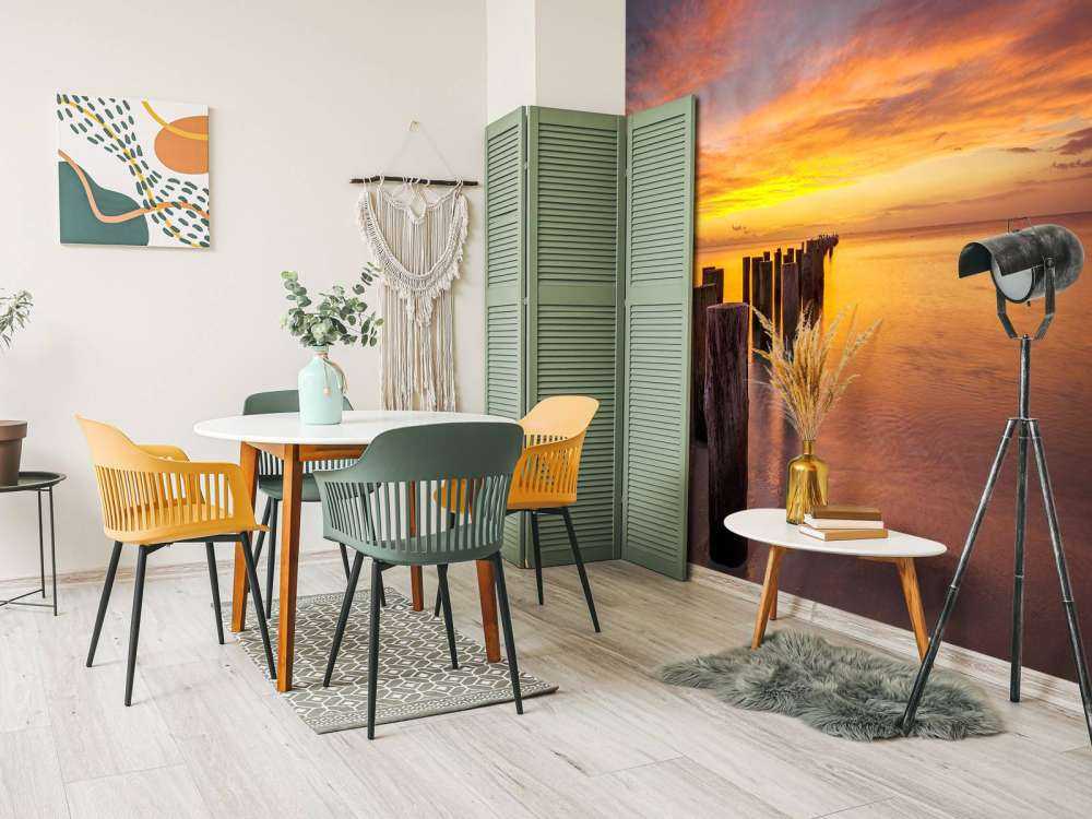 Bølgebrydere ved solopgang