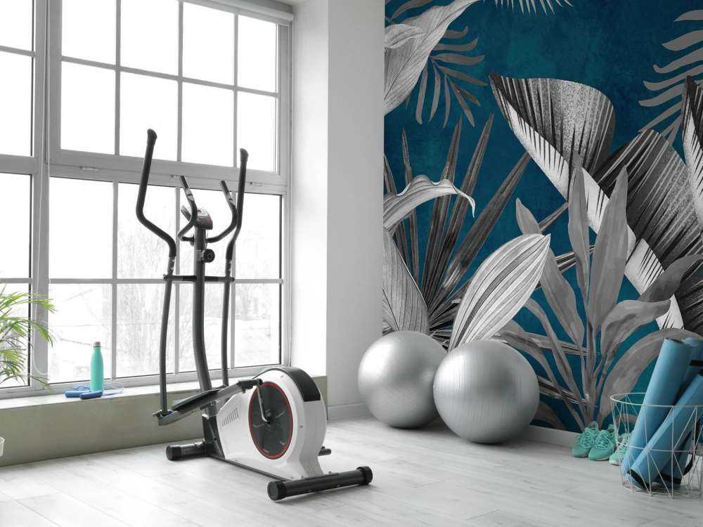 Tropiska blad på en blå bakgrund